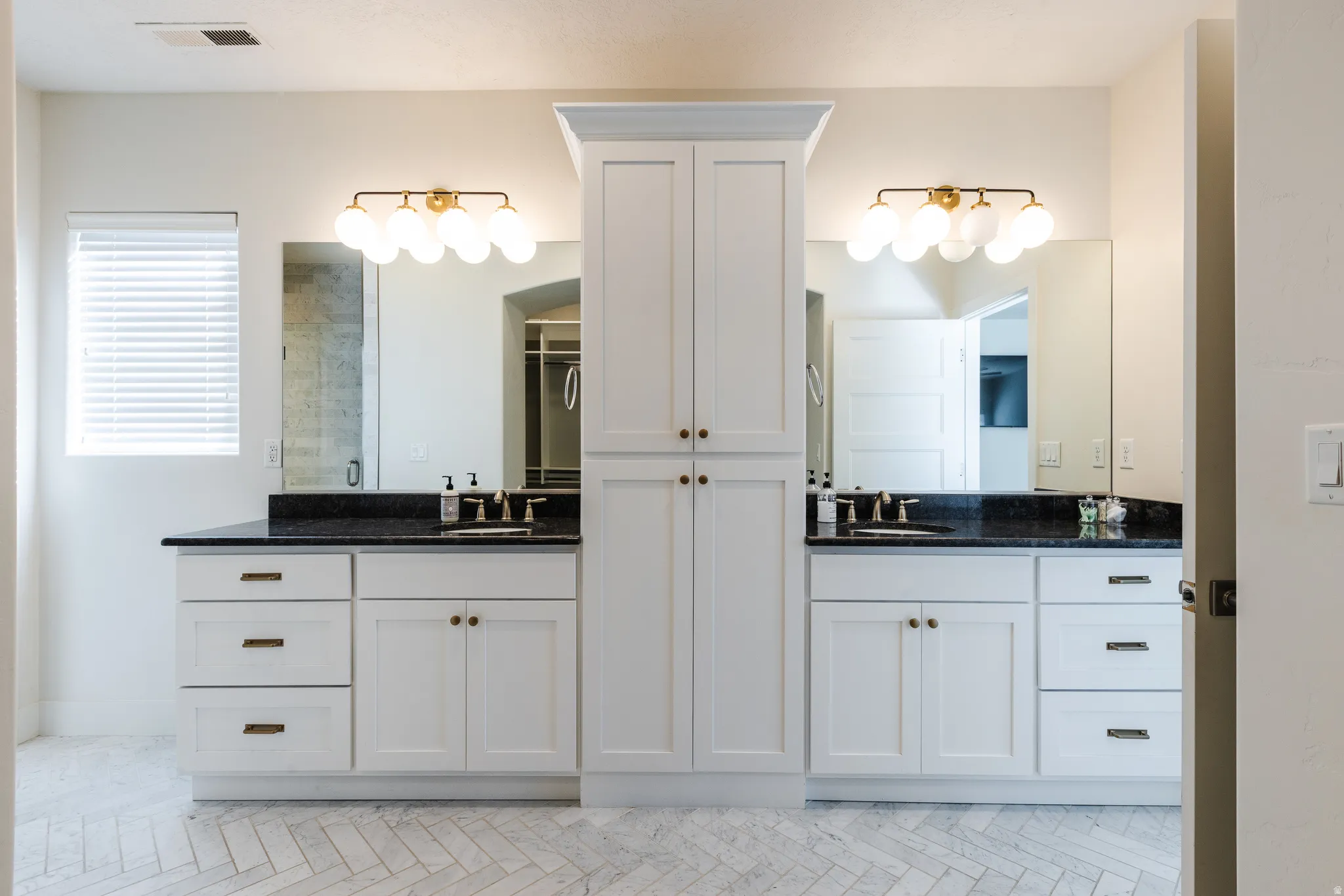 Full bathroom featuring two vanities