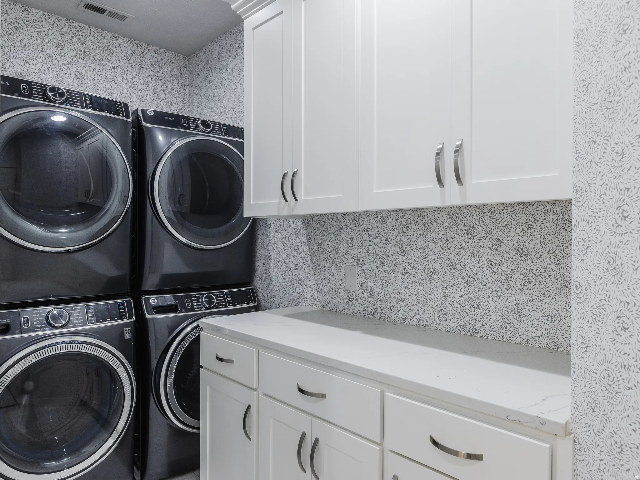 Laundry area with cabinet space