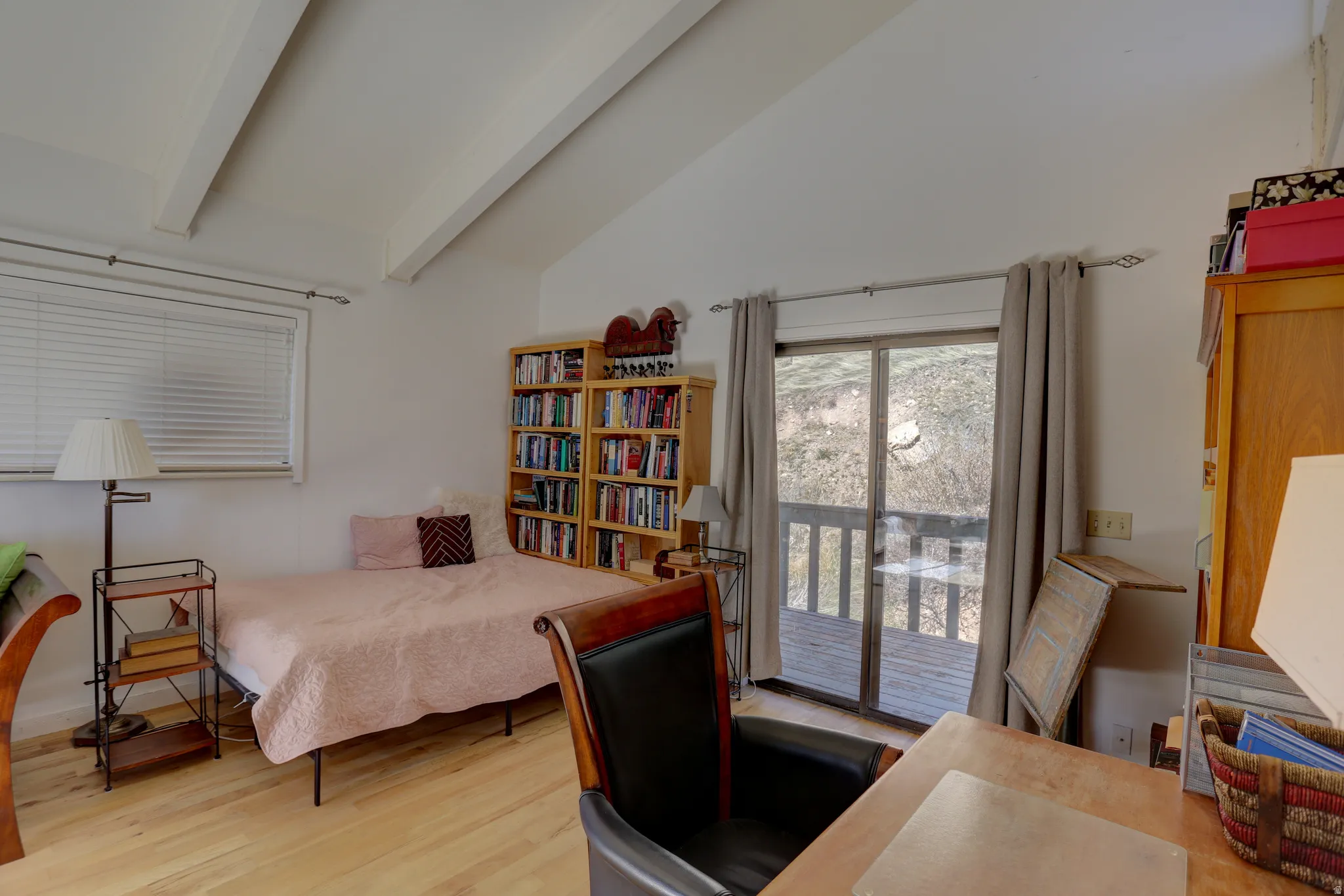Bedroom featuring a desk, access to exterior, vaulted ceiling, and light wood finished floors