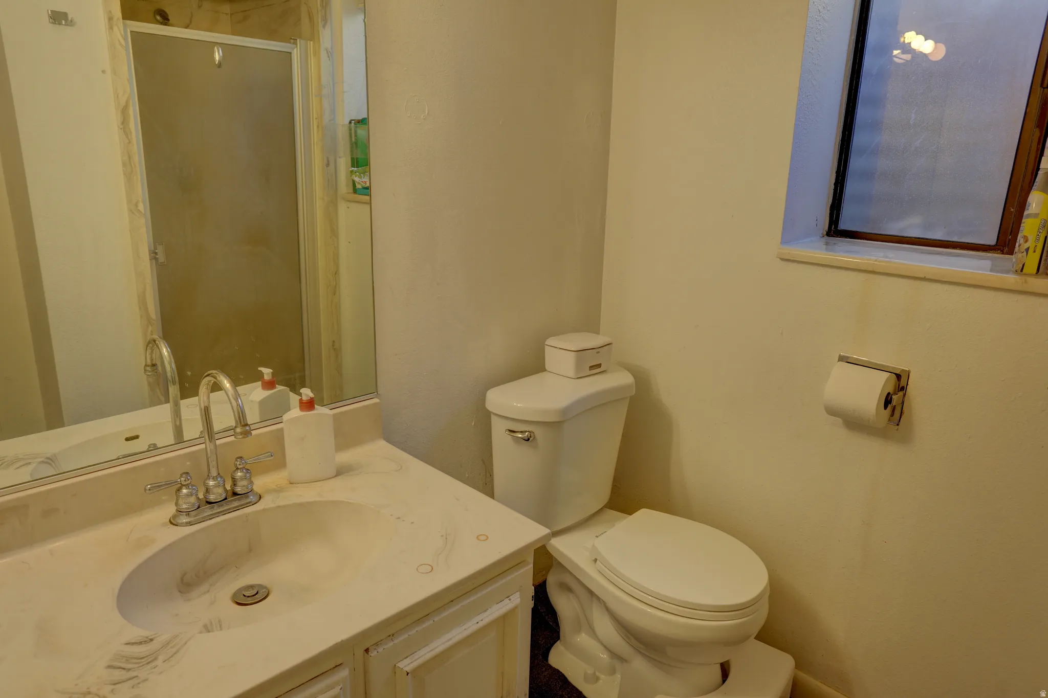 Full bath featuring vanity and a stall shower