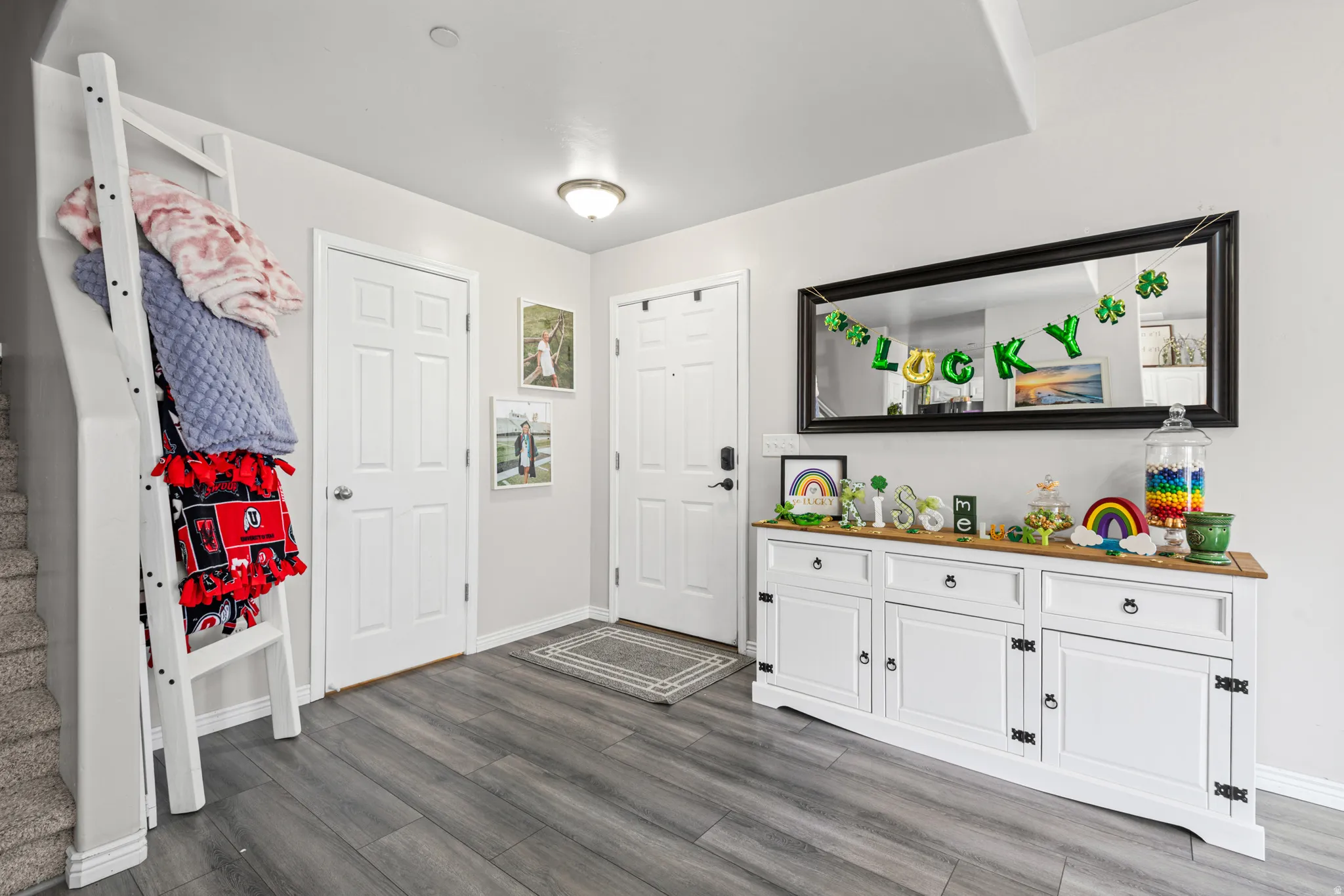 Foyer entrance with dark wood-style flooring