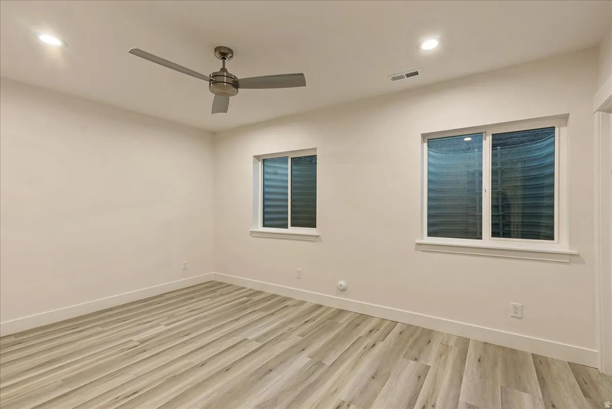 Unfurnished room featuring light wood-style floors, recessed lighting, and ceiling fan