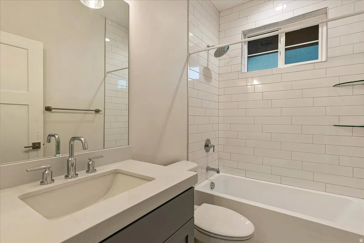 Second bathroom with vanity and tub / shower combination