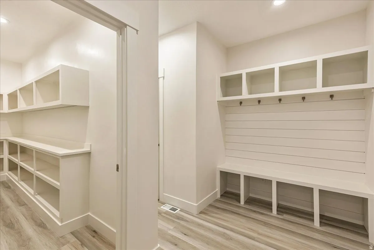 Mudroom featuring recessed lighting and light wood-type flooring