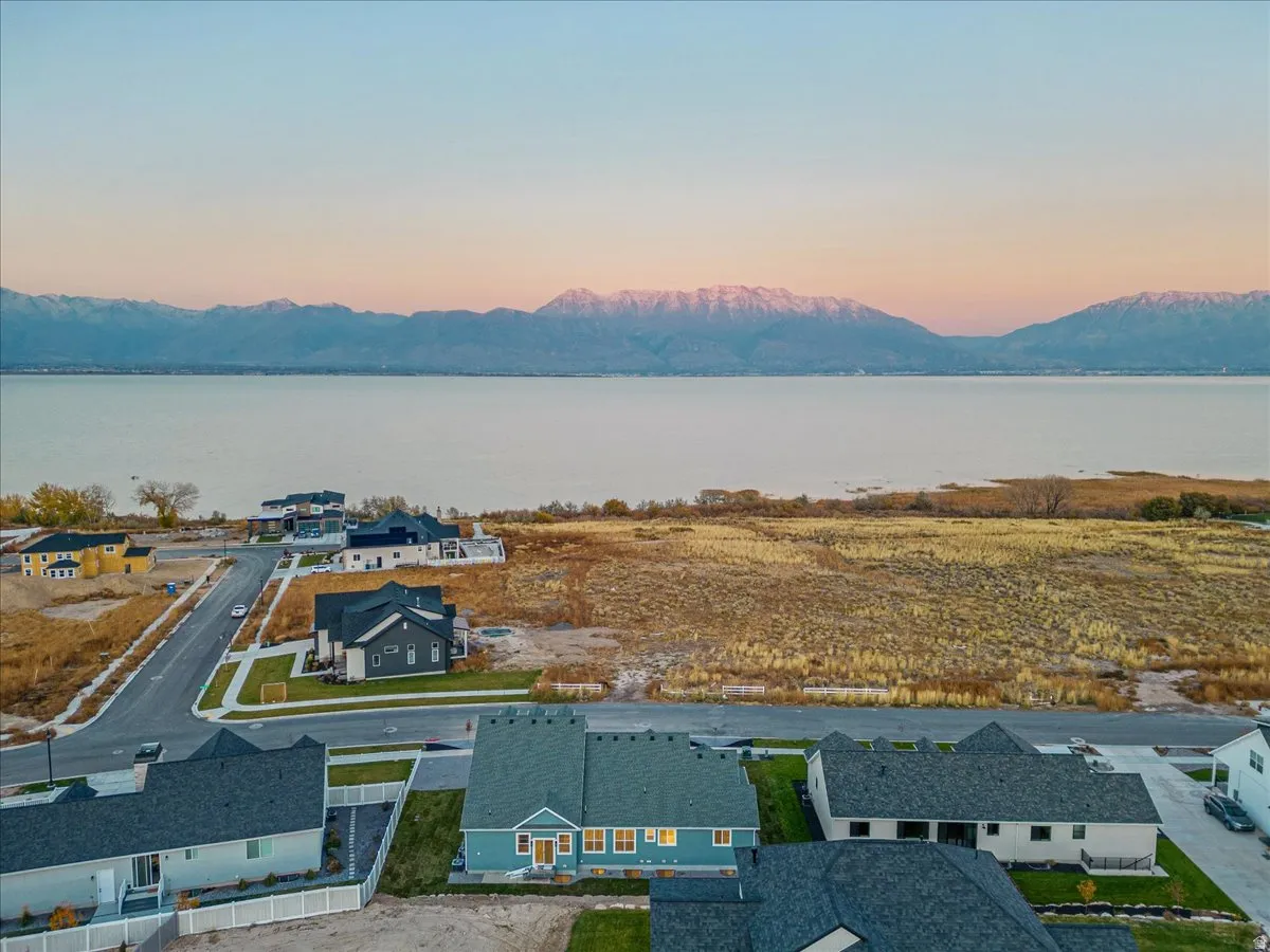Aerial view at dusk of a water and mountain view and a residential view