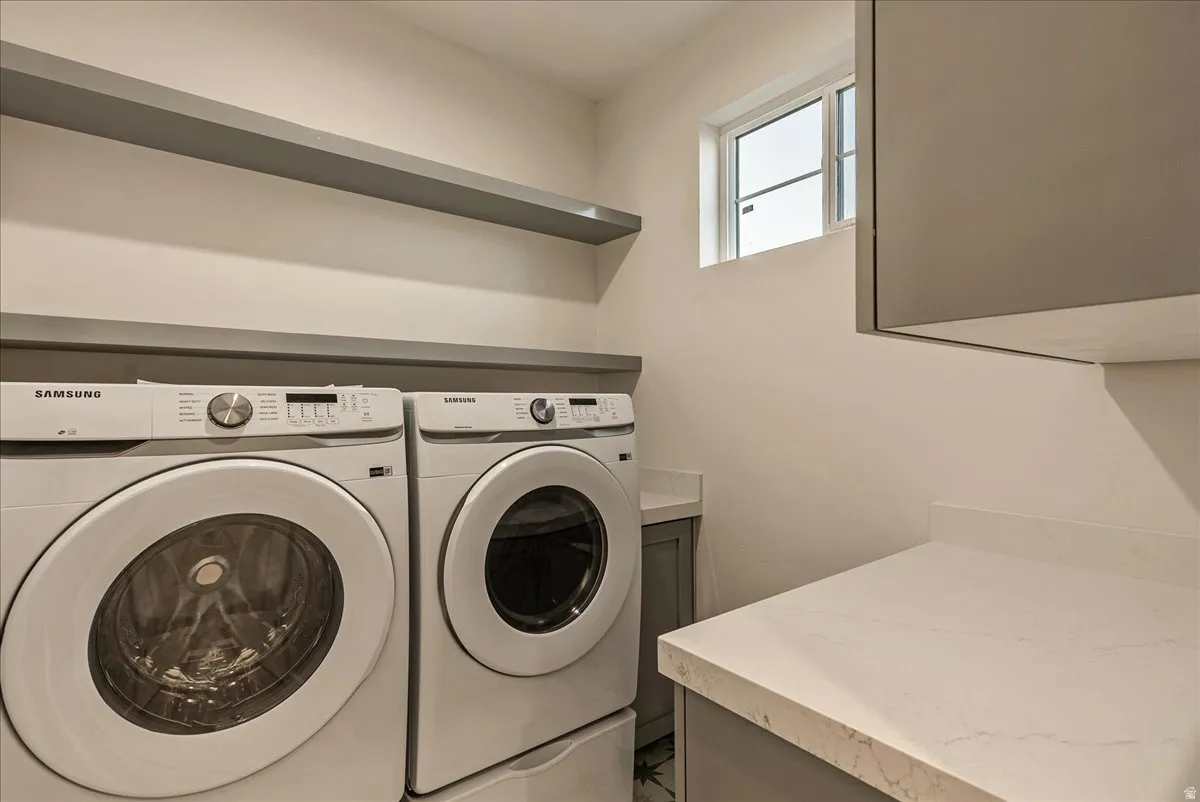 Laundry area featuring independent washer and dryer