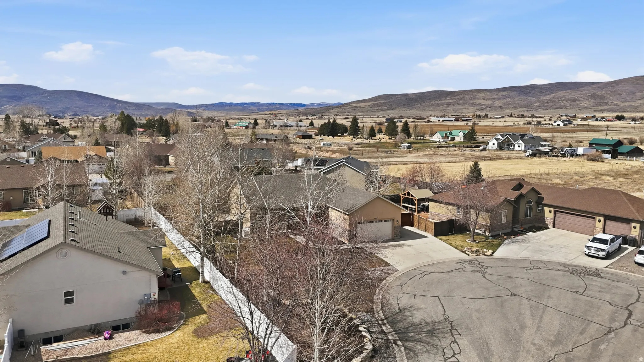 Aerial perspective highlighting a residential community with distant mountain scenery