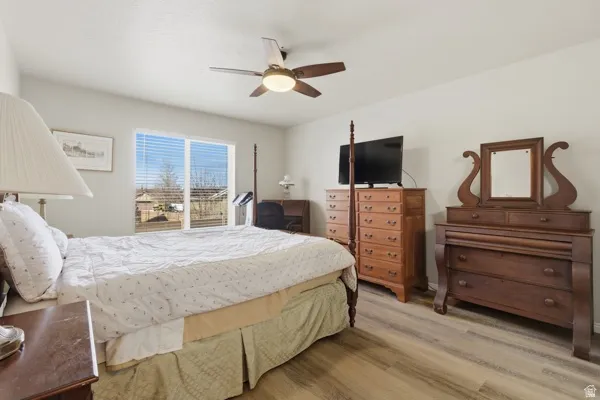 Bedroom featuring light wood finished floors and a ceiling fan