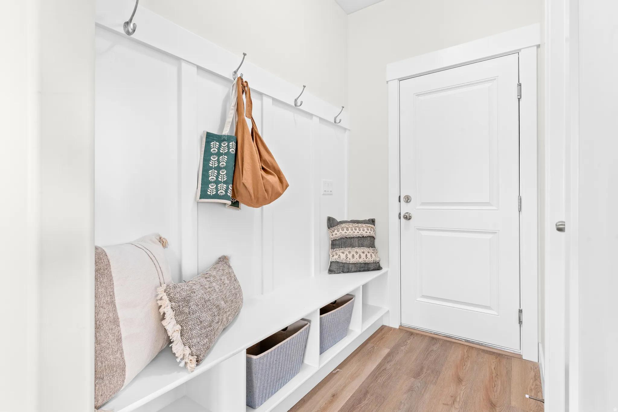 Mudroom with light wood-style floors