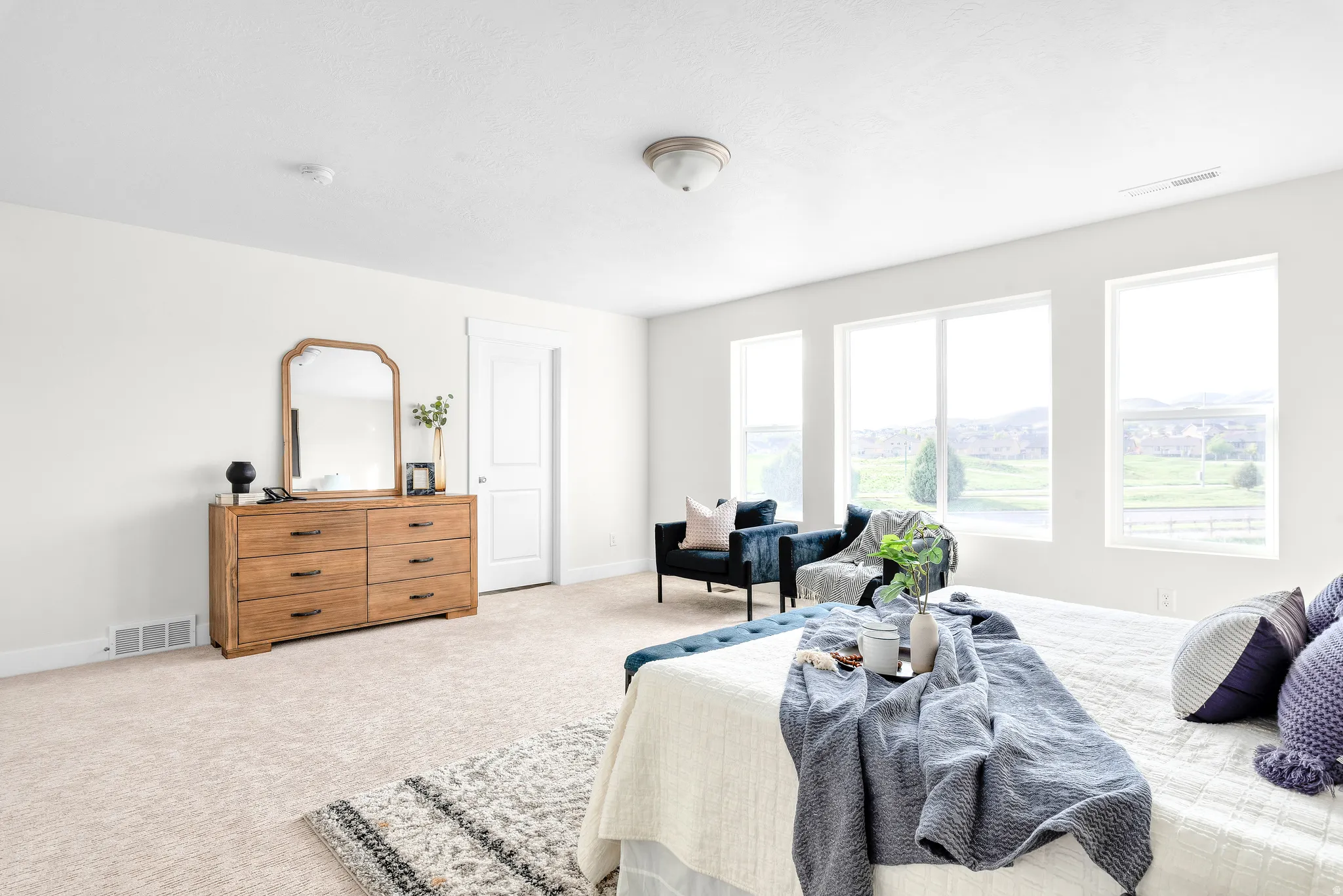 Bedroom with carpet floors and baseboards