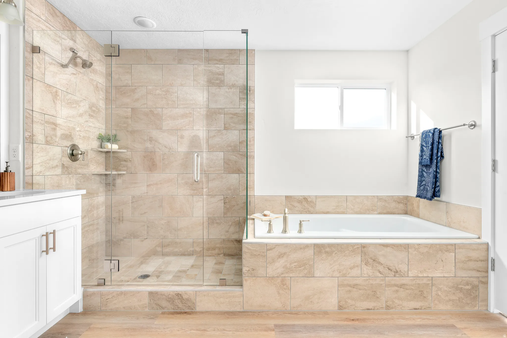 Bathroom with vanity, a shower stall, and a bath