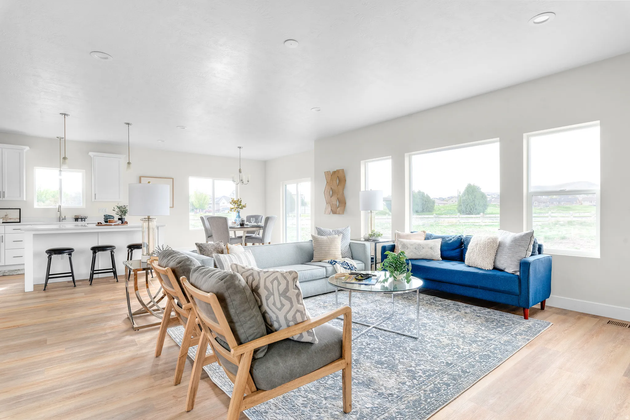 Living room featuring light wood finished floors and a chandelier