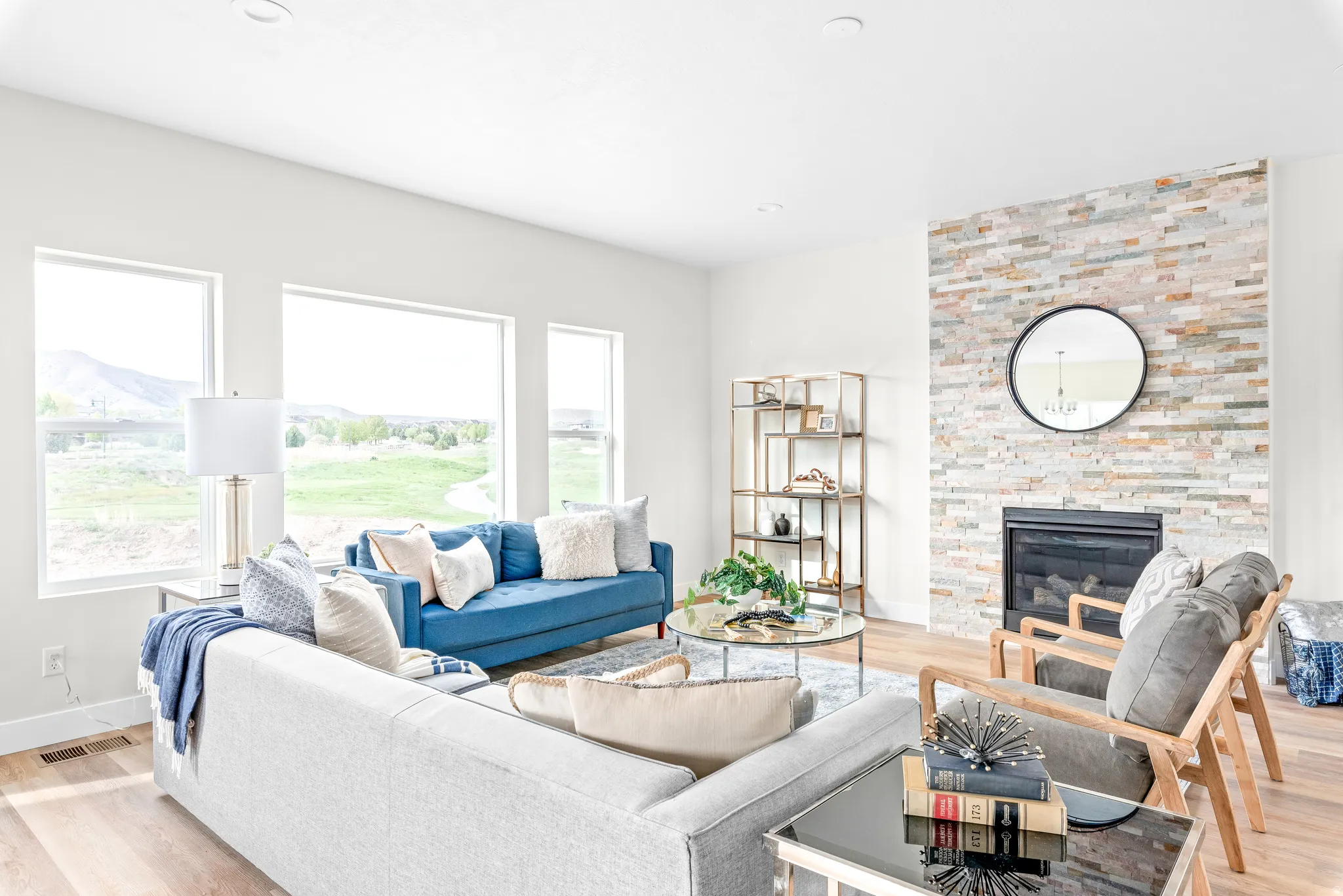 Living area featuring light wood finished floors and a fireplace
