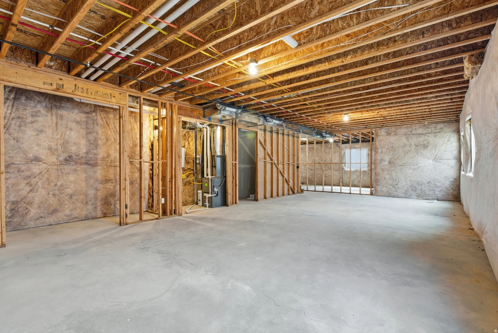 Unfinished below grade area with heating unit