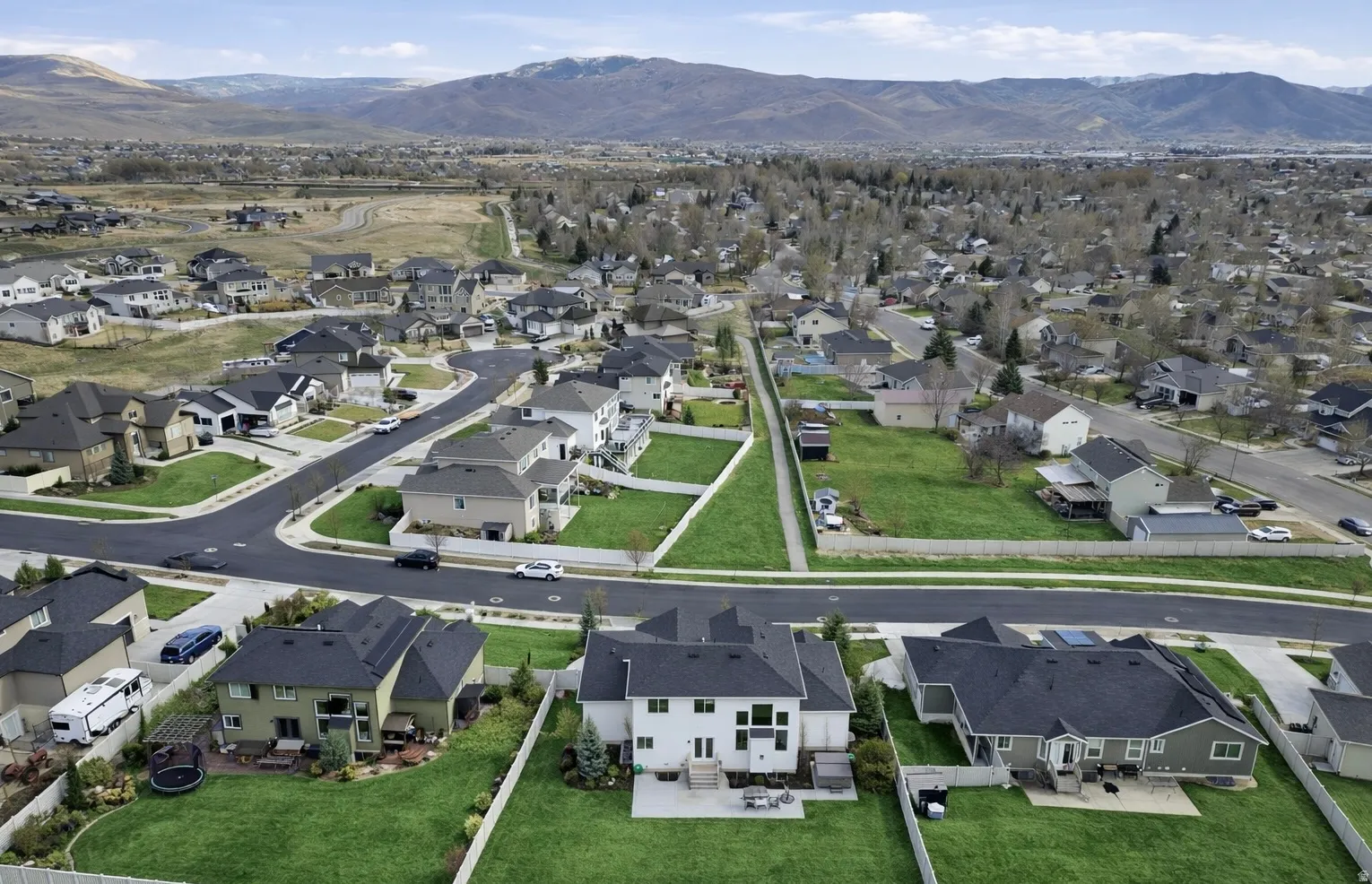 Aerial view of residential area with a mountain backdrop