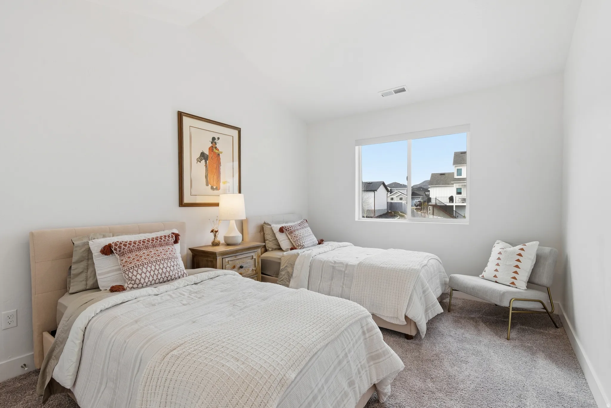 Bedroom with carpet flooring and vaulted ceiling