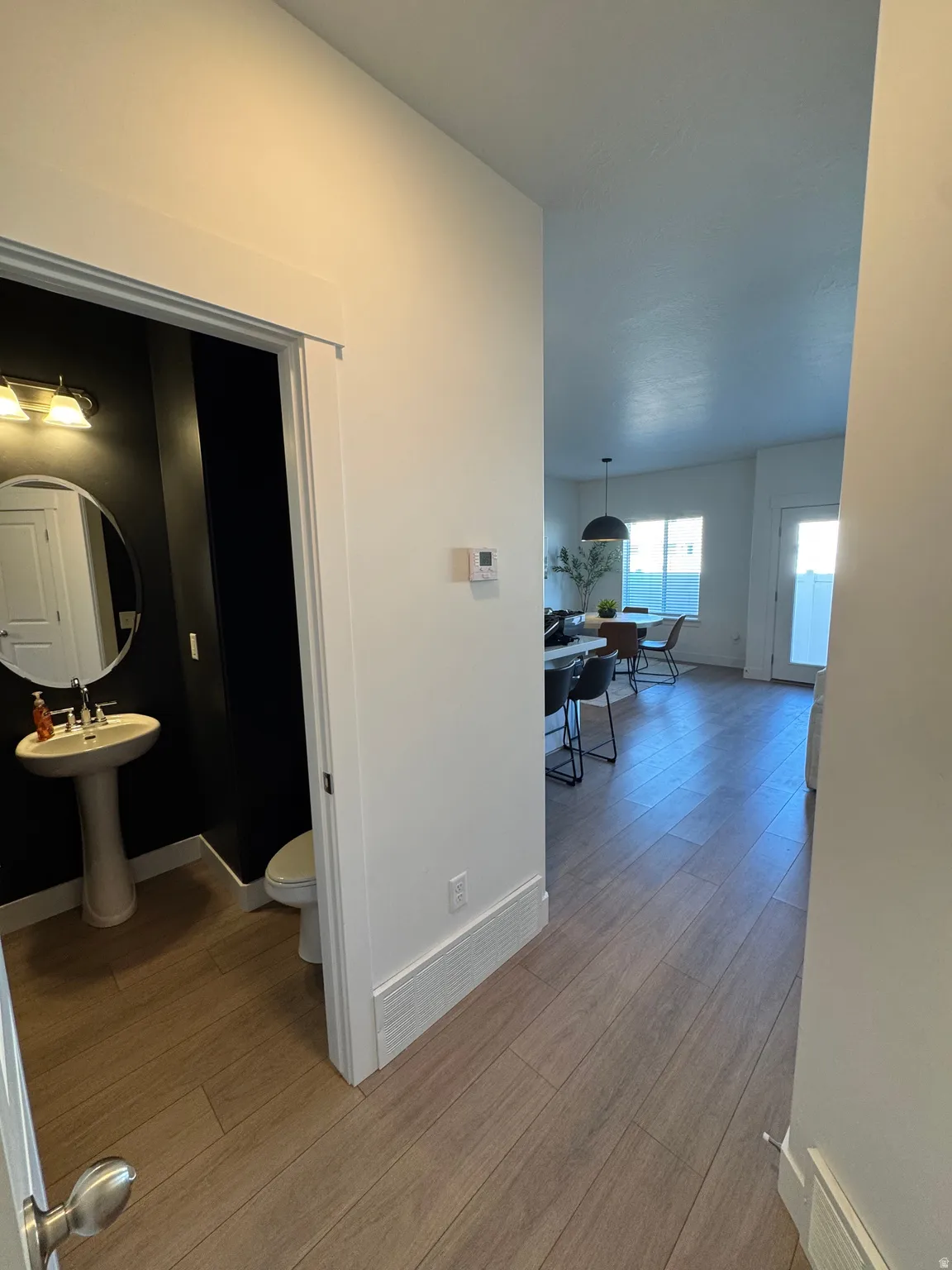 Hallway with light wood-type flooring