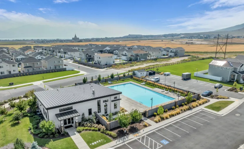Aerial view of residential area with a pool area and mountains