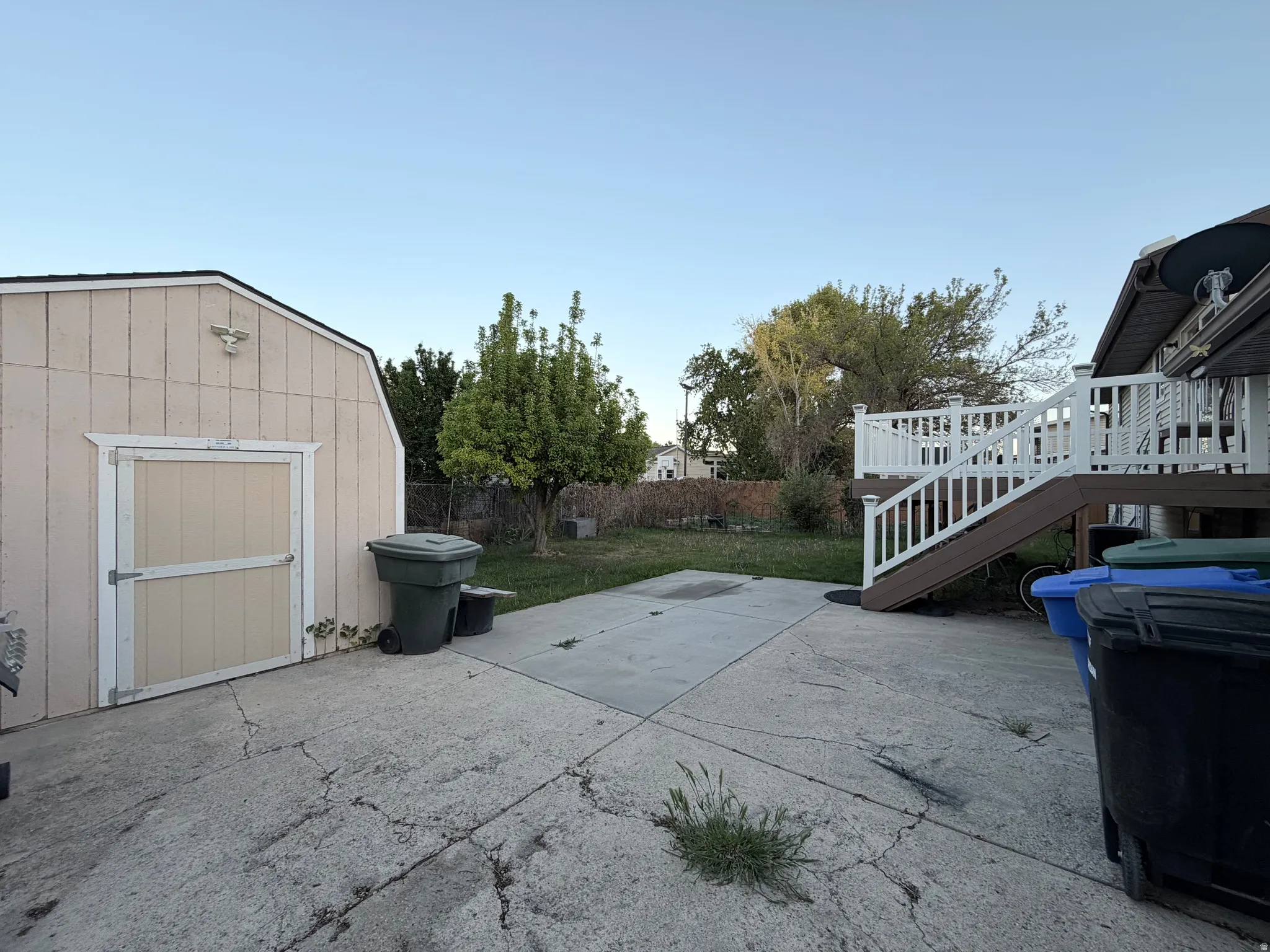 View of patio / terrace featuring a shed and a deck