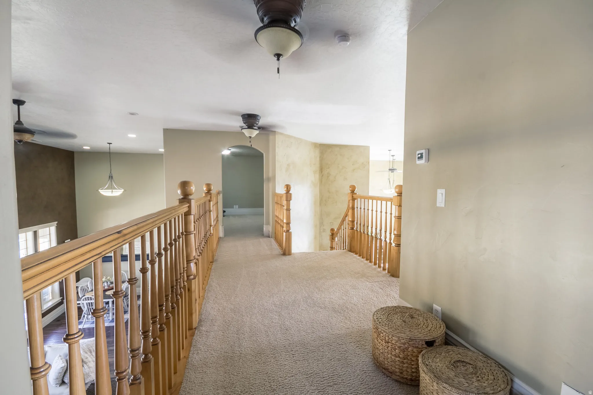 Corridor featuring carpet flooring, an upstairs landing, and recessed lighting