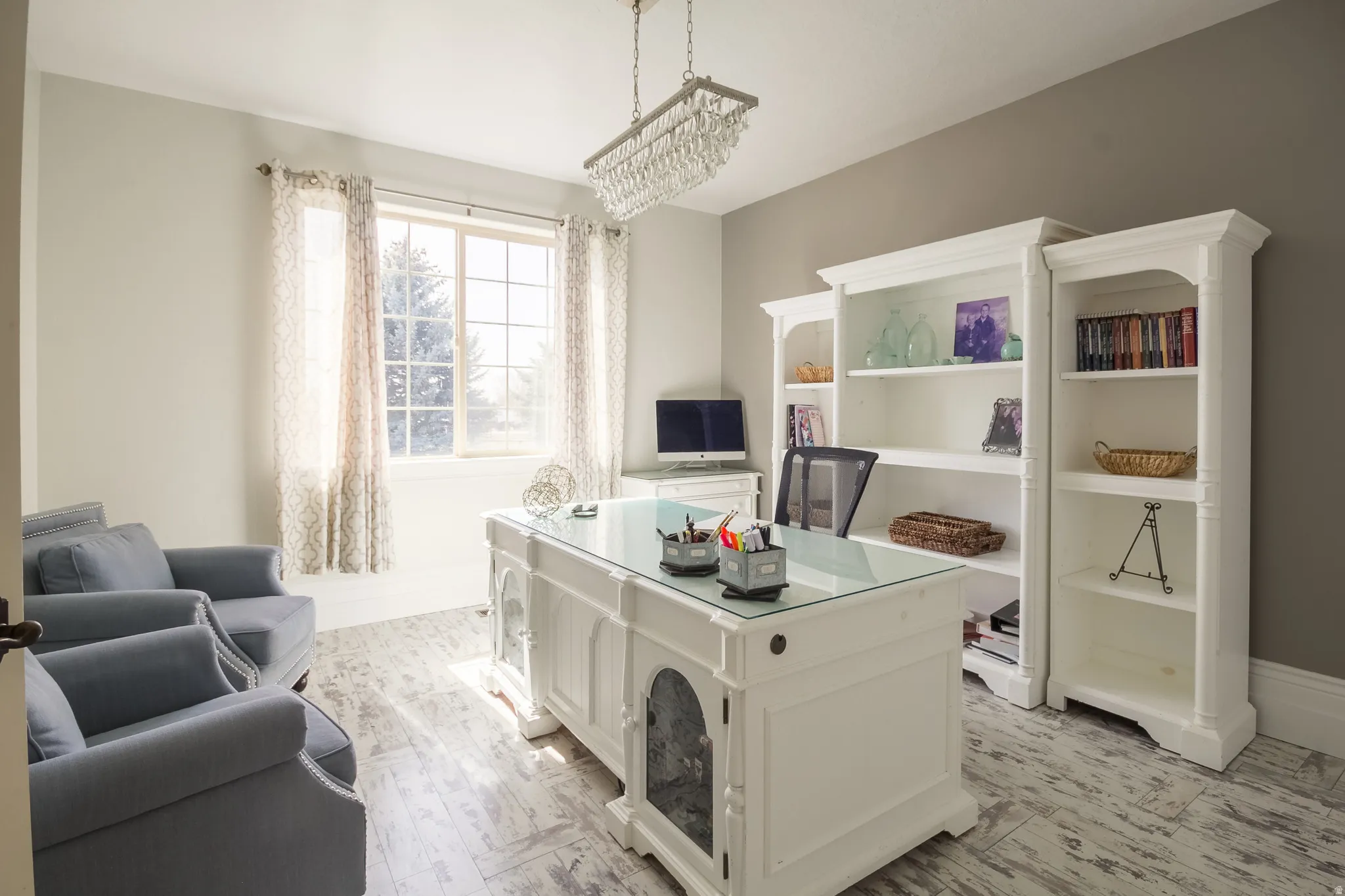 Office area featuring baseboards