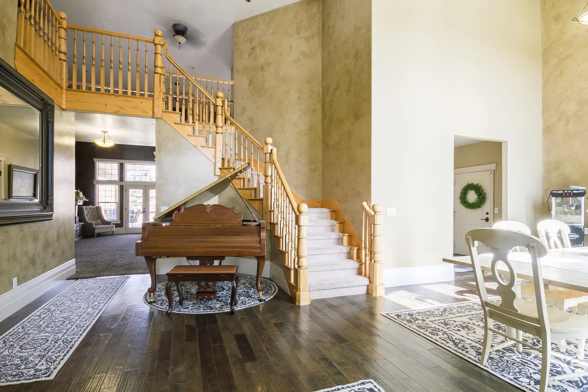 Foyer featuring a high ceiling and hardwood / wood-style flooring