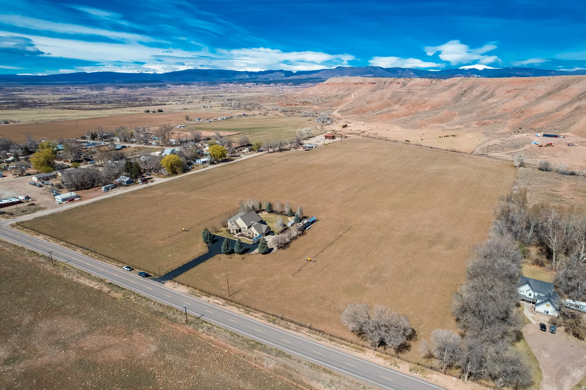 Aerial view of sparsely populated area with a mountain backdrop