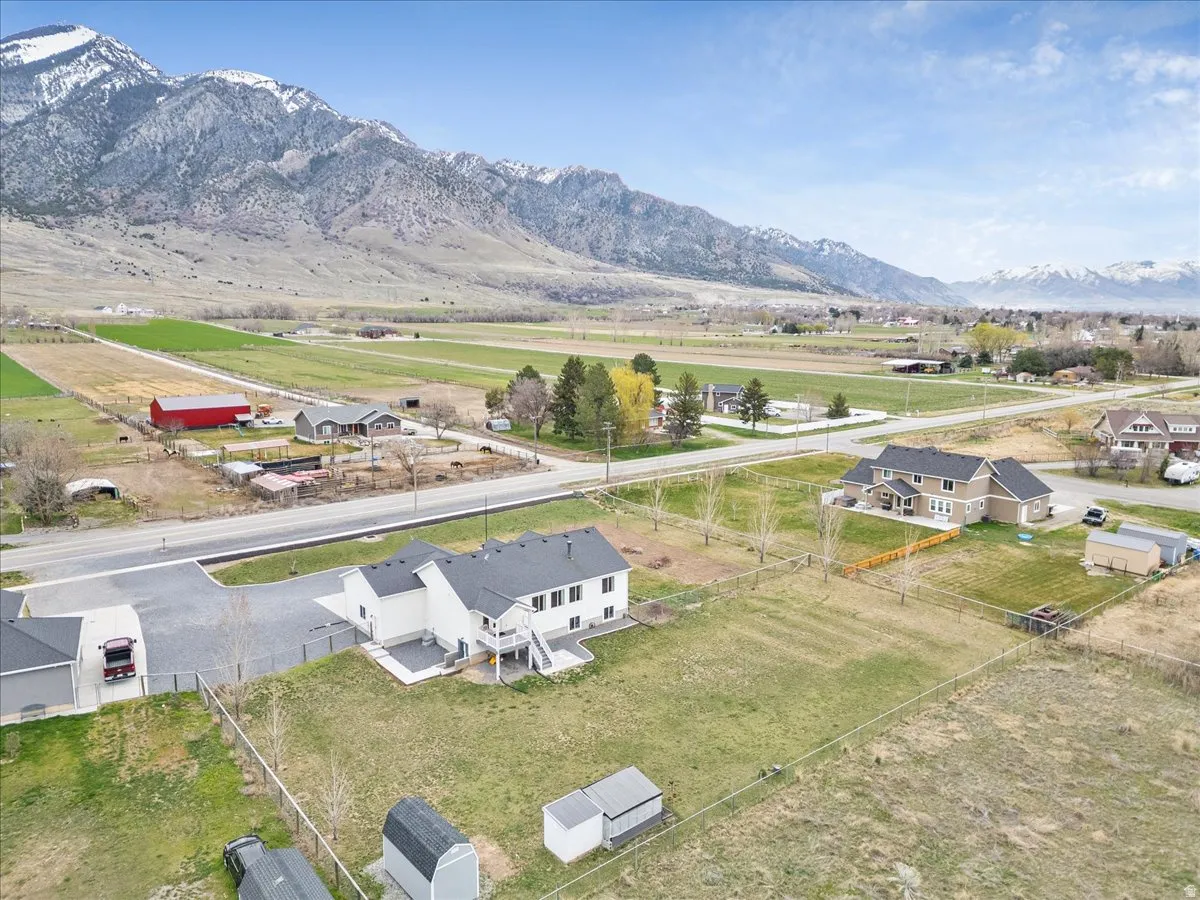Aerial perspective of suburban area featuring a mountainous background