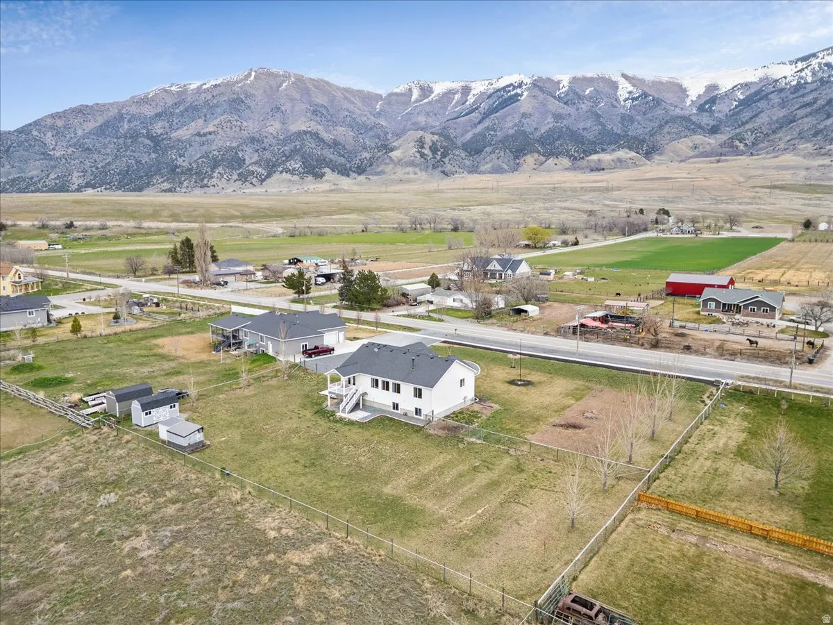 Aerial view of property's location featuring mountains and rural landscape