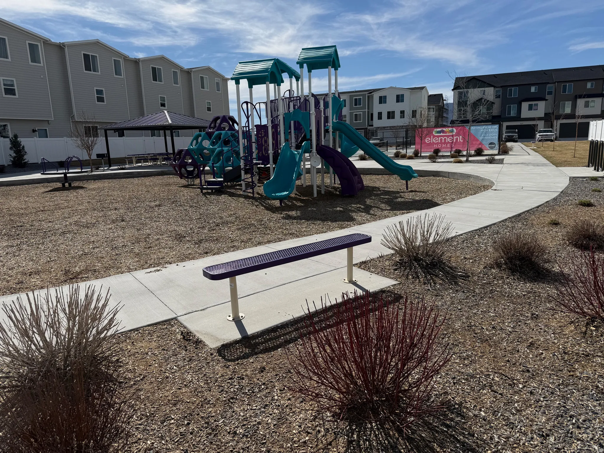 Communal playground featuring a residential & mountain view