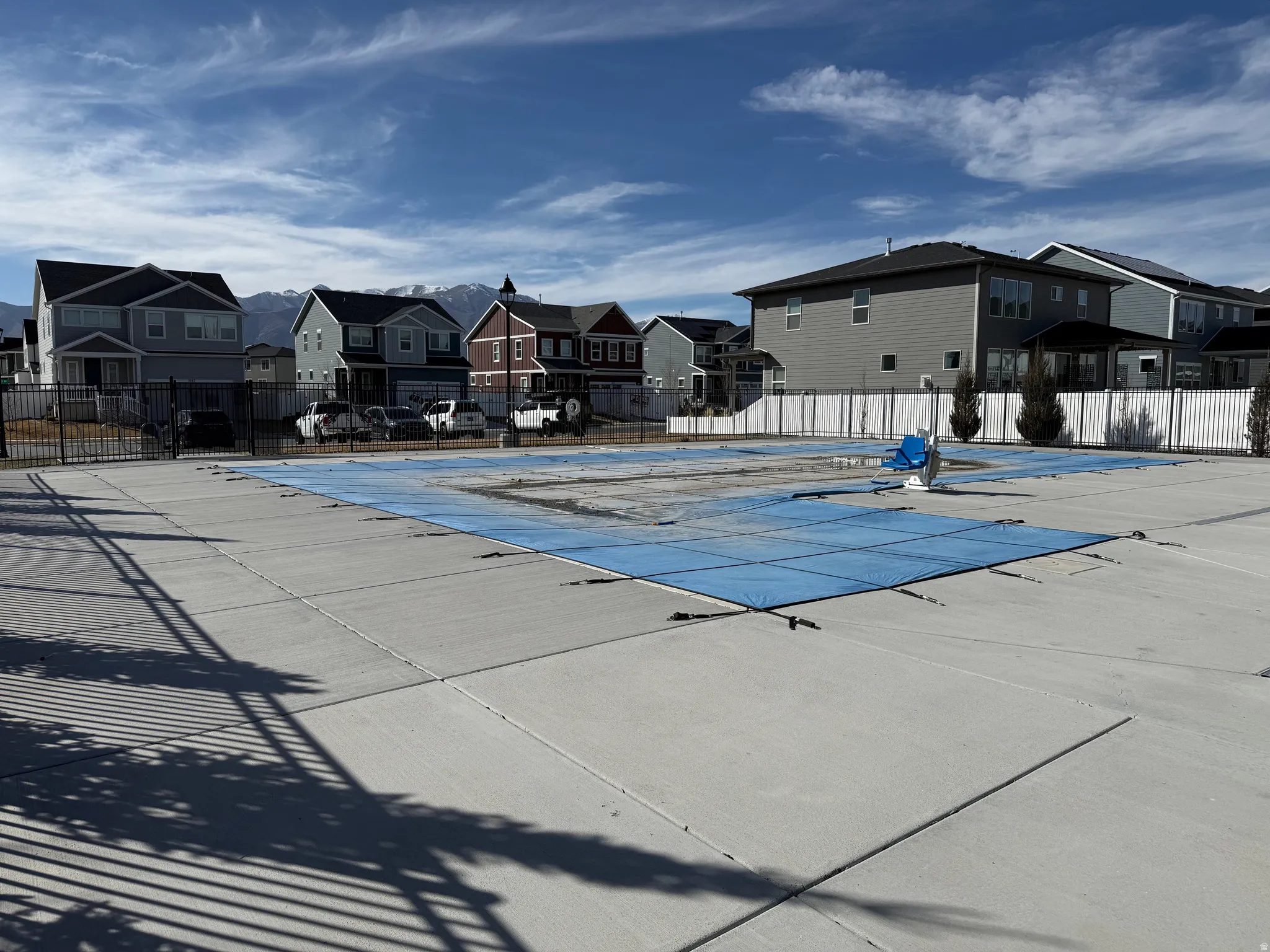Community pool featuring a residential view