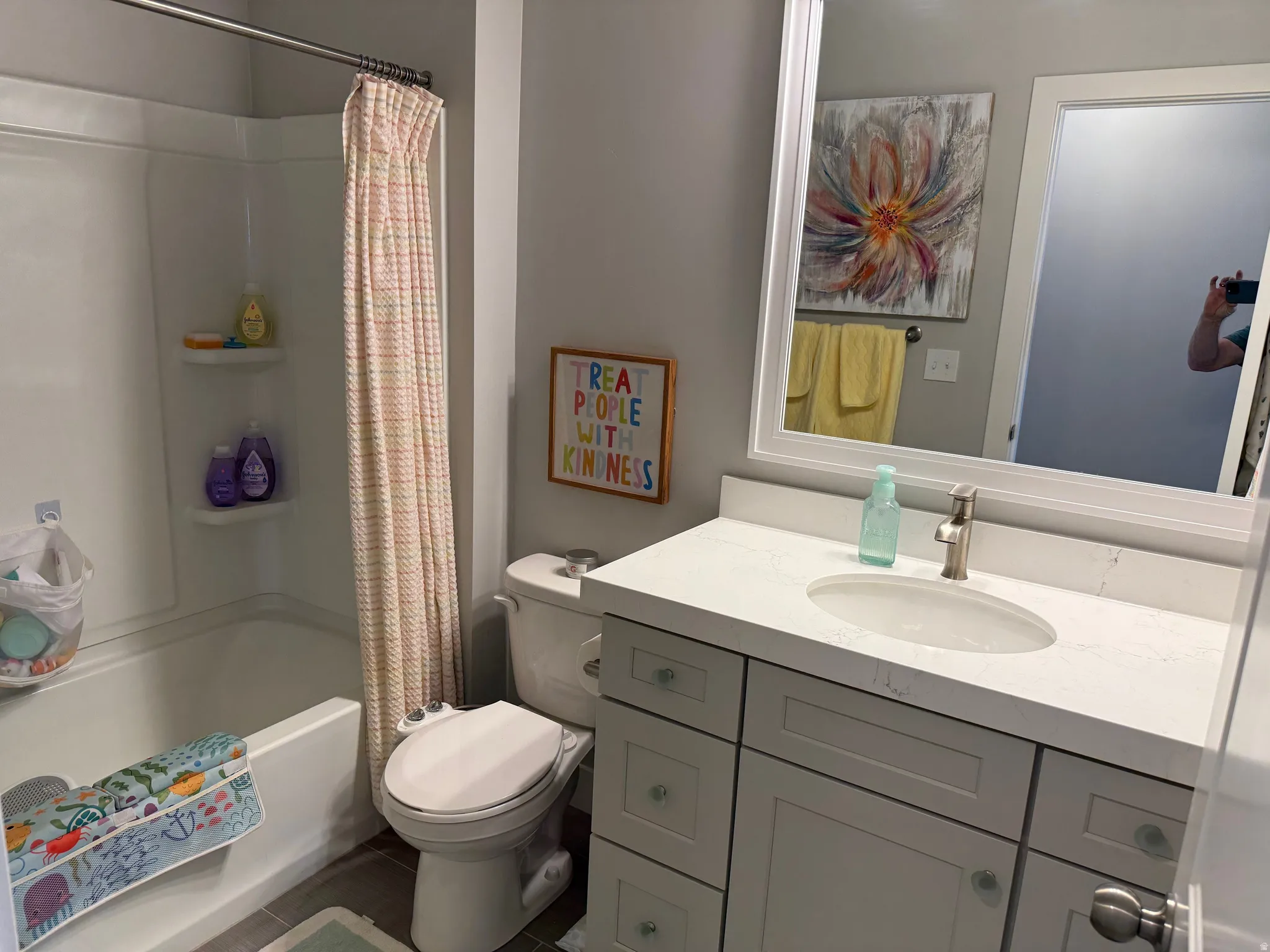 Bathroom with vanity, shower / bath combo, and tile patterned floors