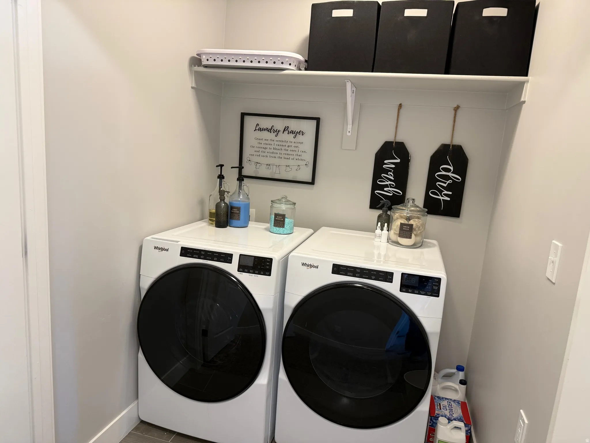 Laundry room featuring washer and dryer and baseboards