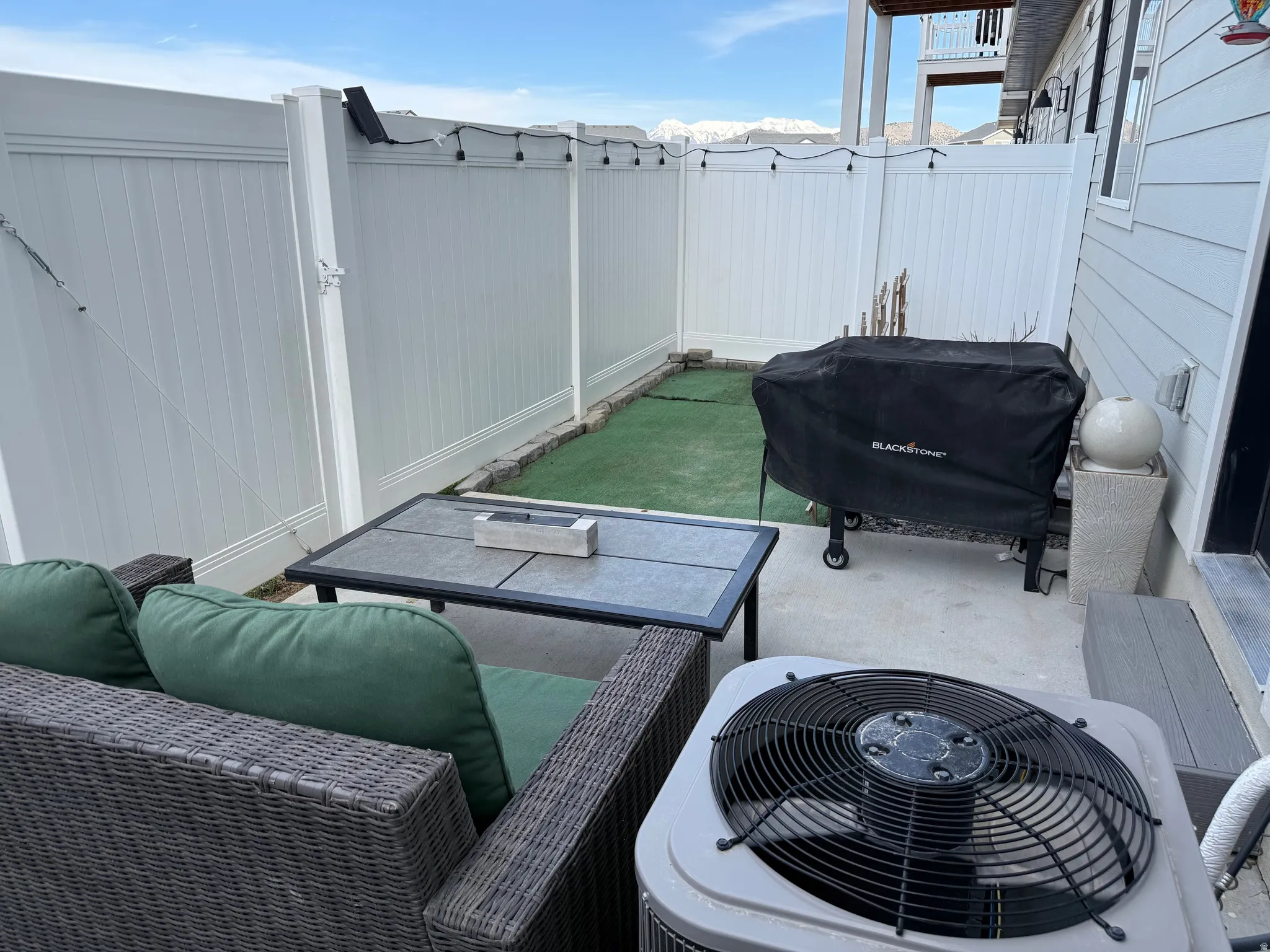 Fenced backyard featuring an outdoor living space. Great for pets.
