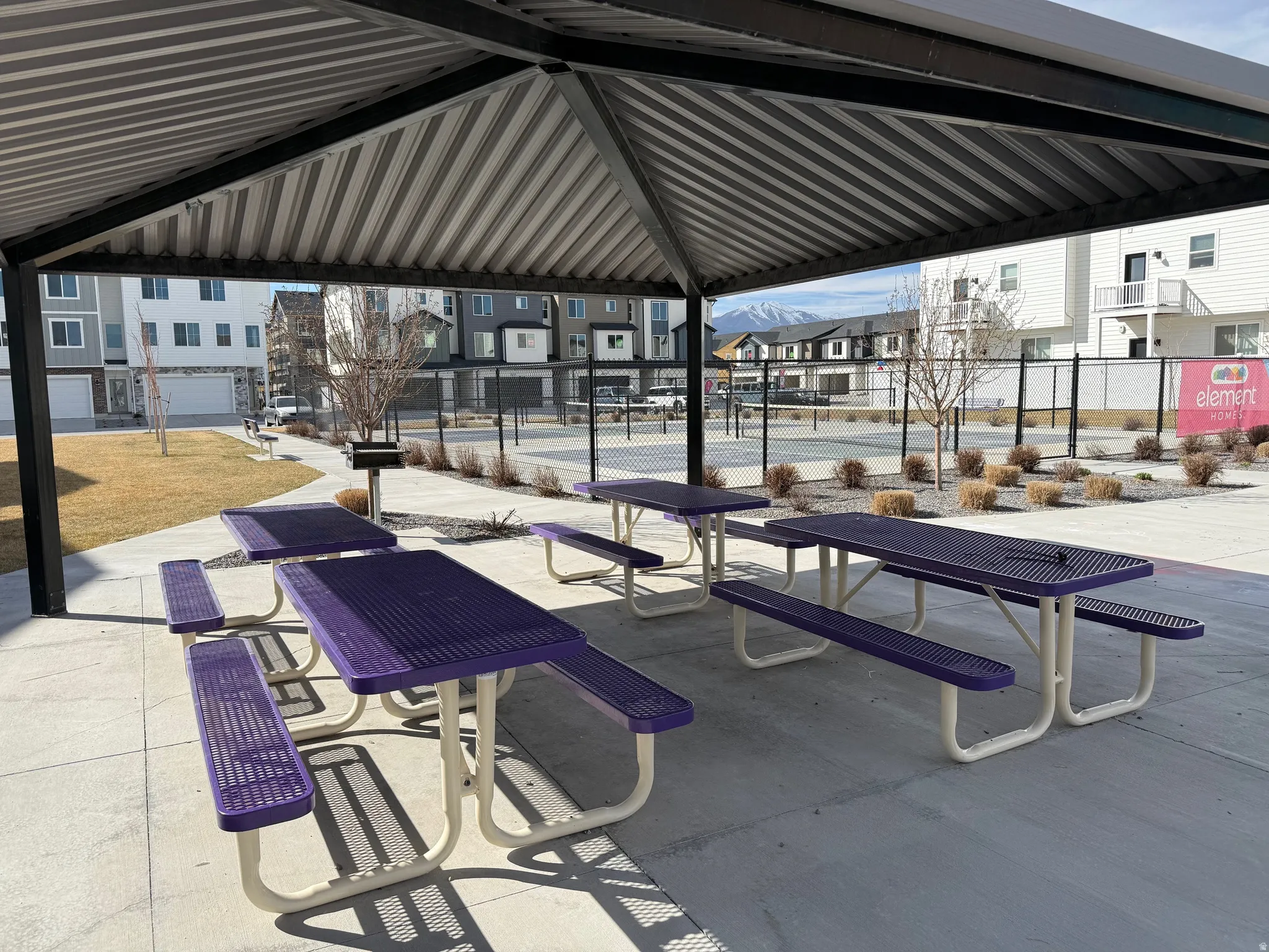 Surrounding community with a residential view and a pickleball courts