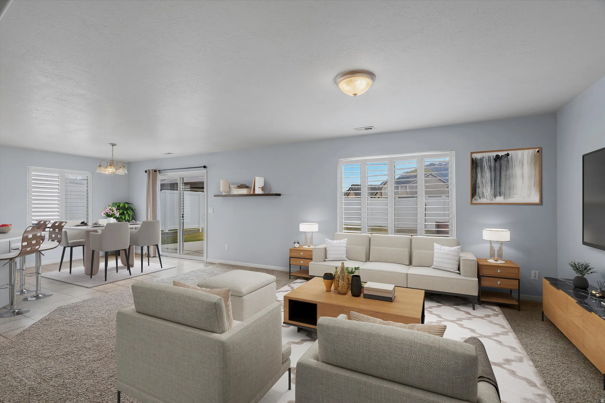 Living area featuring baseboards and hanging lights