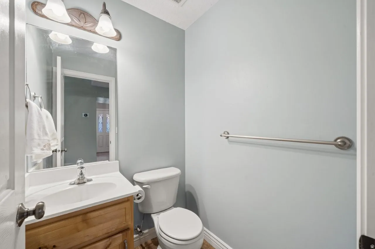 Half bath with vanity and toilet