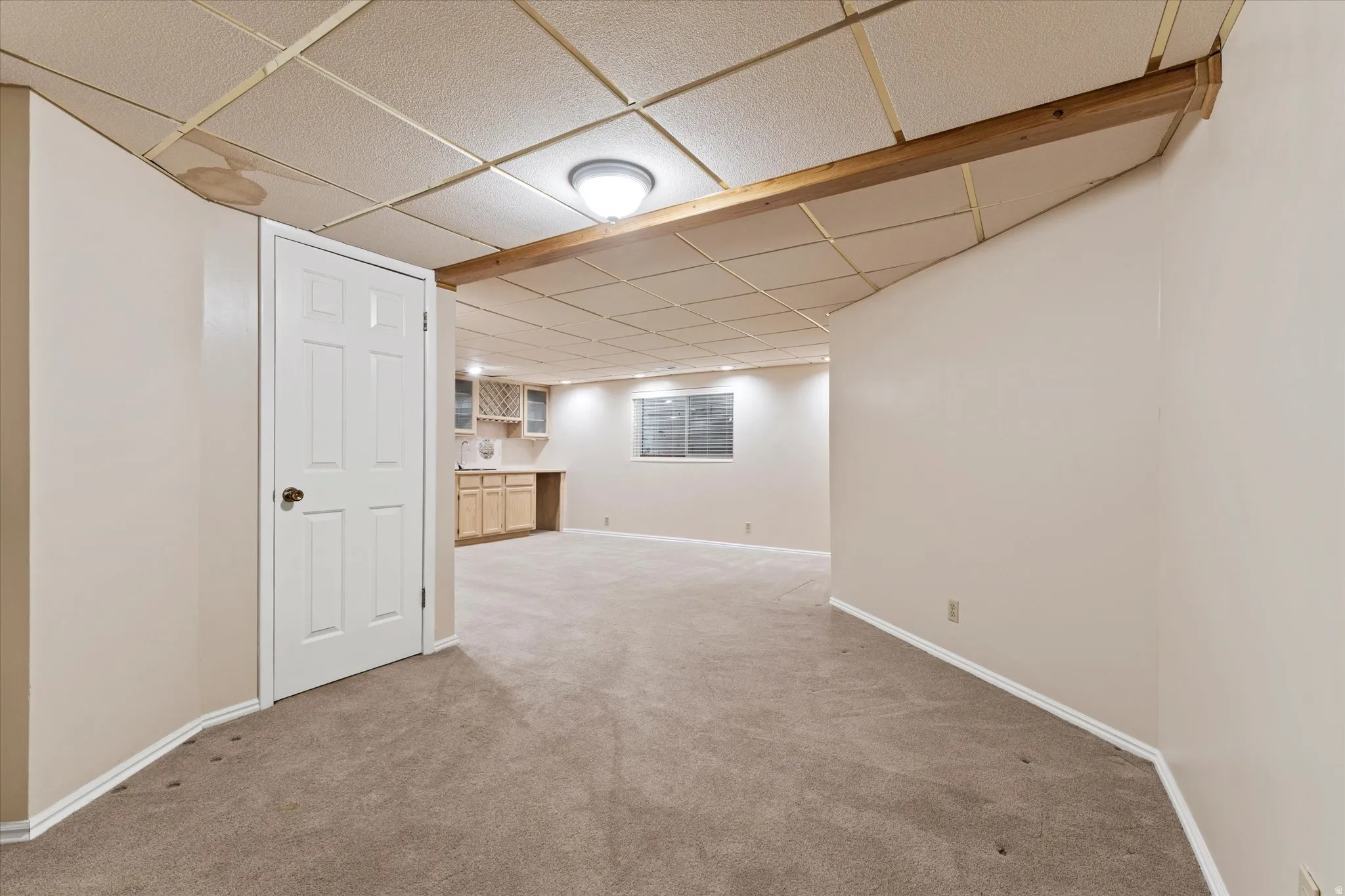 Flexible lower-level space with ample room for seating, hobbies, or guest accommodations.