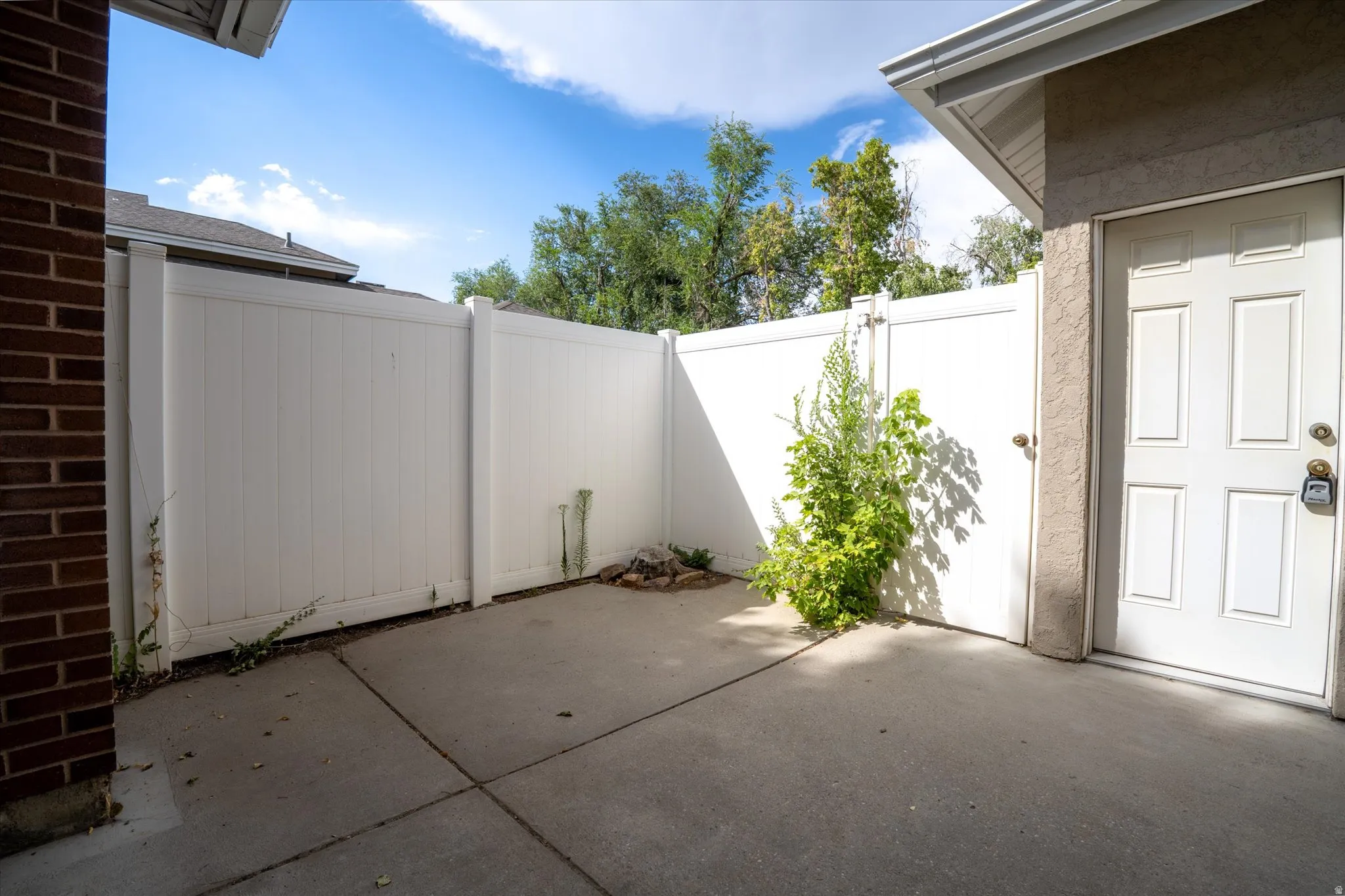 Quiet, fenced outdoor area with direct access to the home, offering a comfortable and secluded setting.