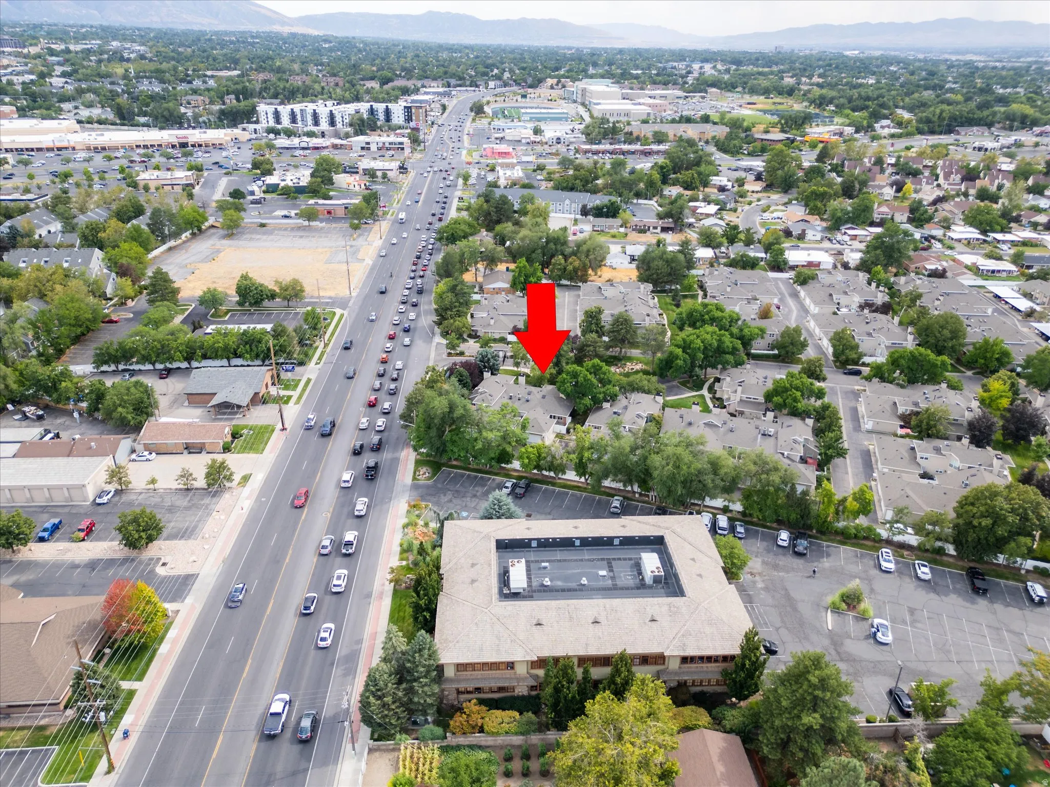 Elevated view showcasing the home’s position within the community, with nearby main roads, shopping, and everyday conveniences just moments away.