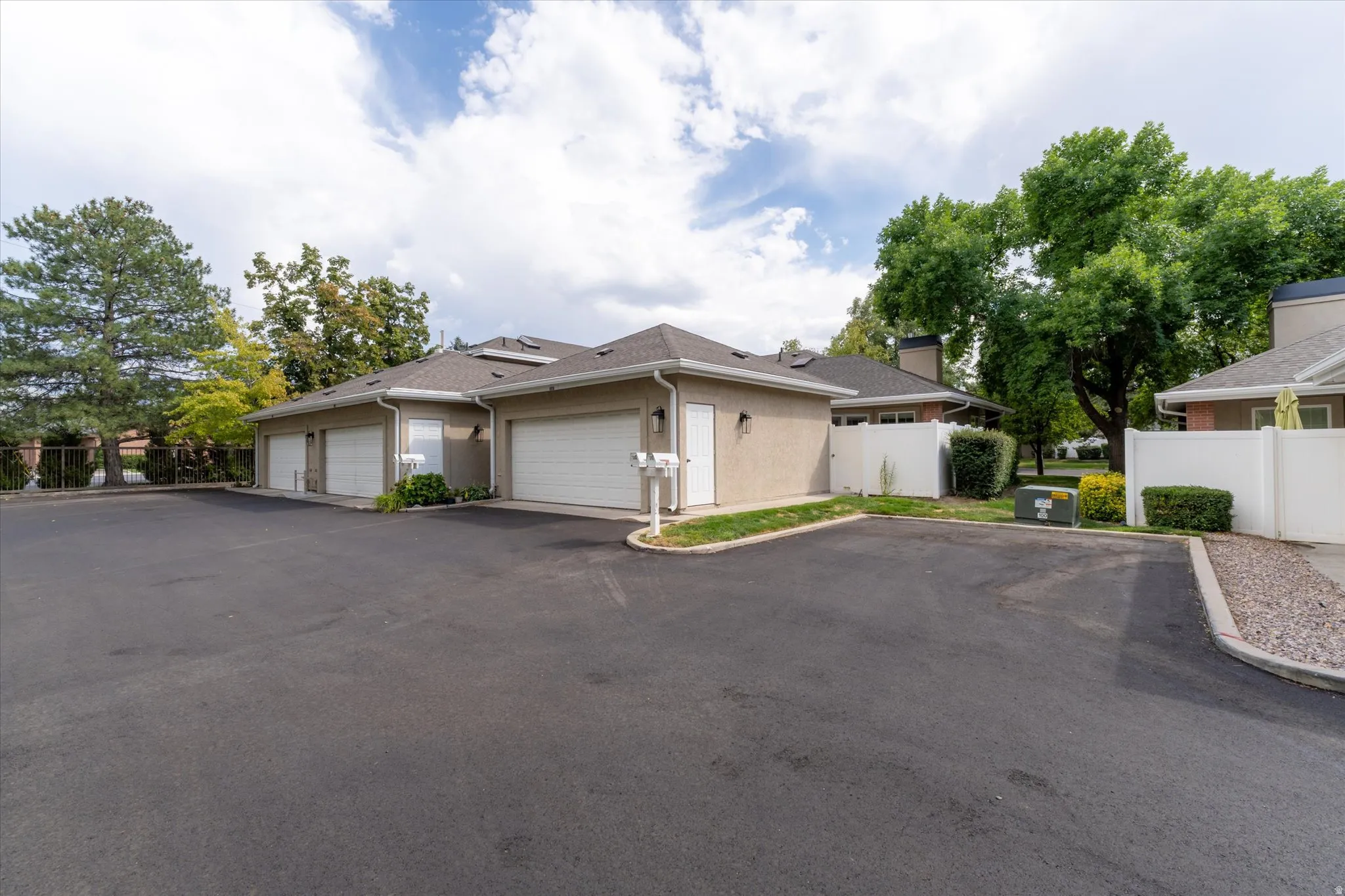 Attached garage space with convenient access and additional parking nearby, offering practical storage and everyday ease.