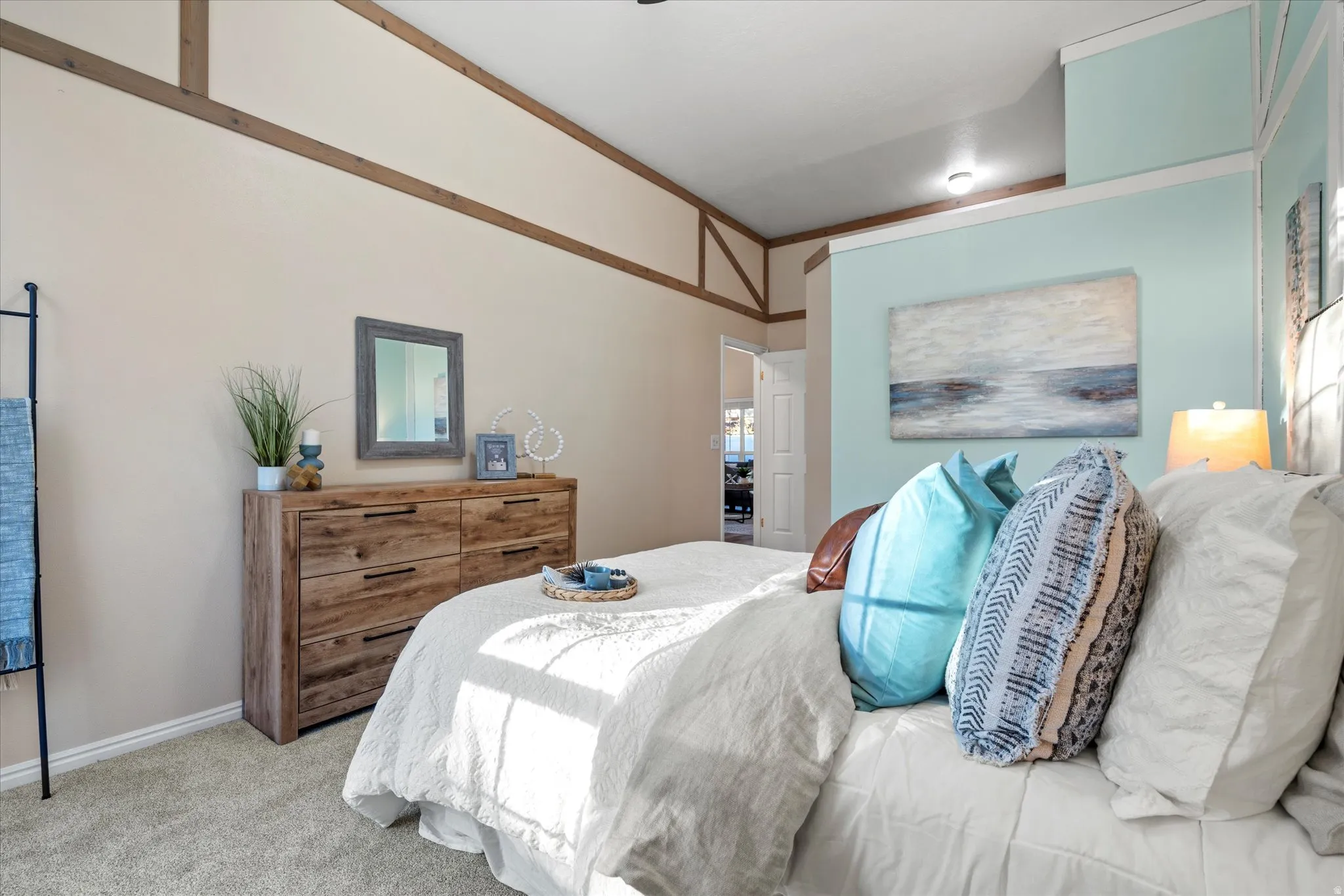 Bedroom featuring light colored carpet and crown molding