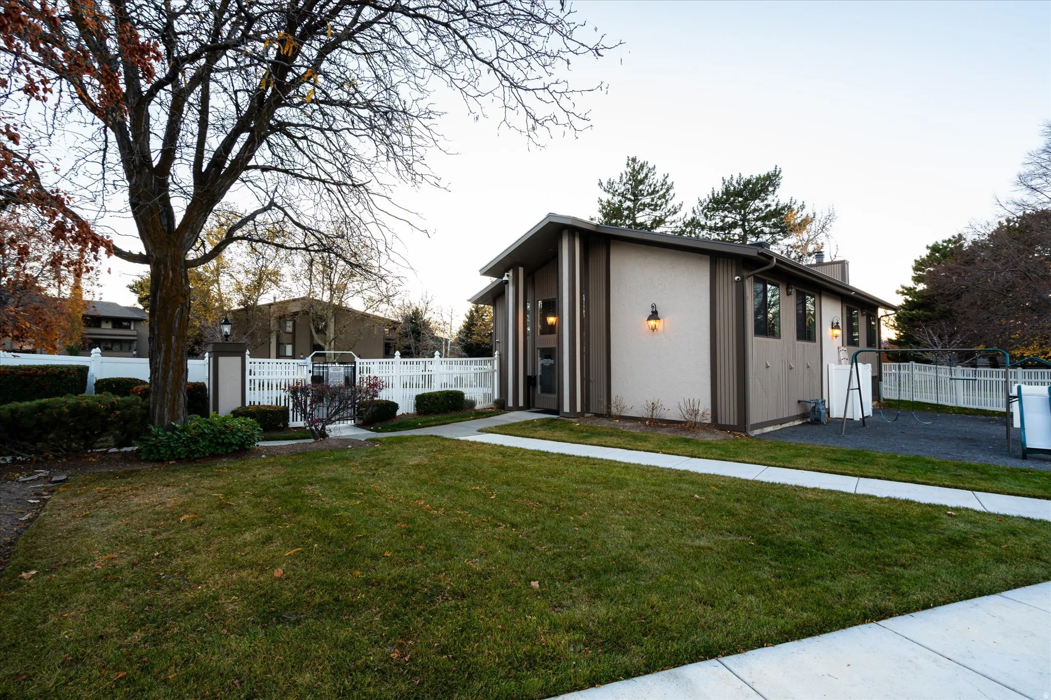 Nicely landscaped common areas with sidewalks and green space, creating a peaceful, park-like setting throughout the community.
