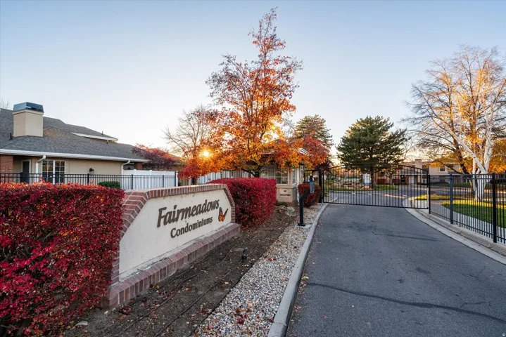 ated entry to Fairmeadows Condominiums with mature landscaping and well-maintained grounds, offering a welcoming first impression.