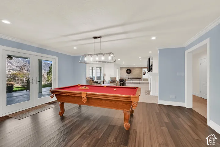 Playroom with french doors, pool table, recessed lighting, ornamental molding, and dark wood-style floors