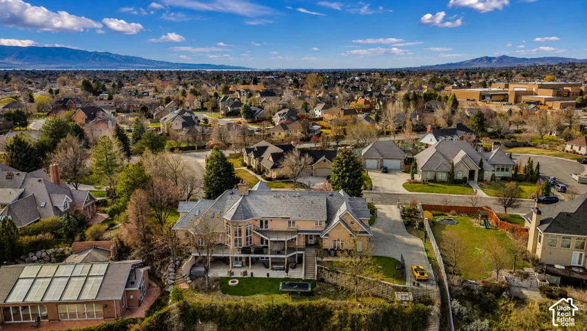 Estate-style property featuring a multi-story design with extensive rear decking