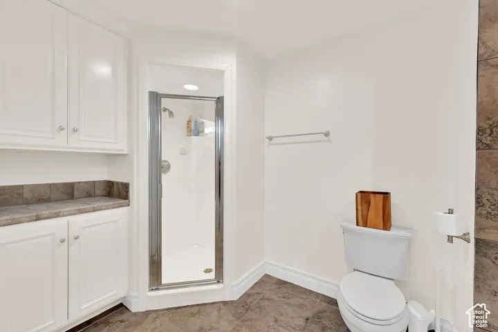 Bathroom featuring a stall shower and vanity