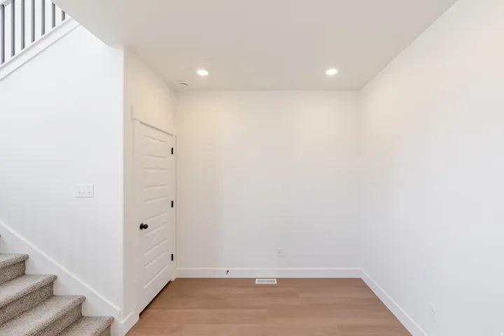Interior space featuring wood-finish flooring and recessed lighting