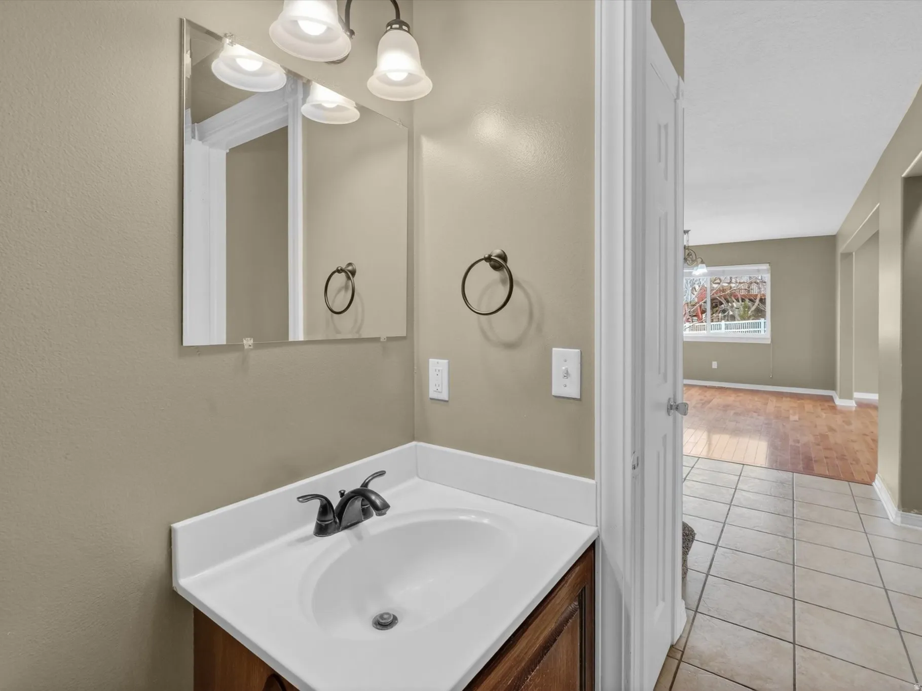 Bathroom with vanity and light tile patterned floors