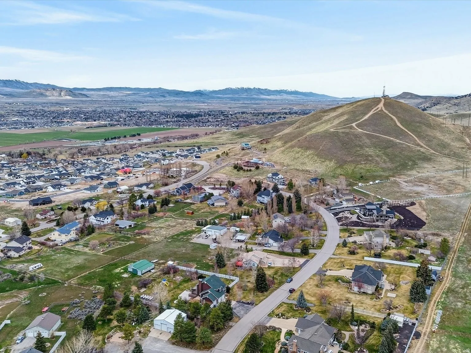 Aerial perspective of suburban area with a mountainous background